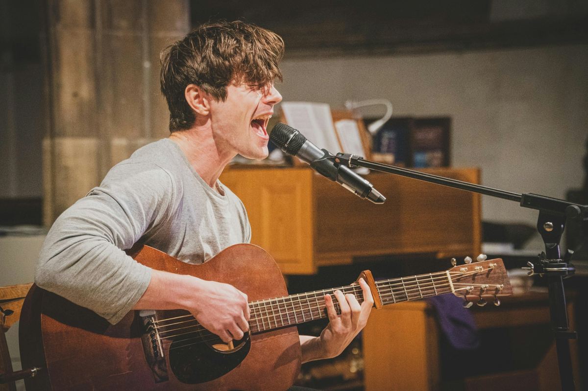 Solo performer with acoustic guitar