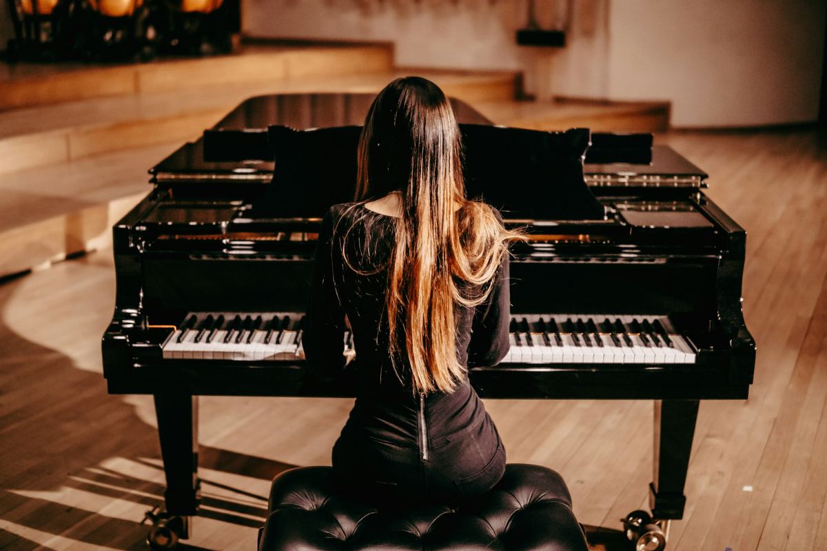 Pianist at a grand piano during a recital