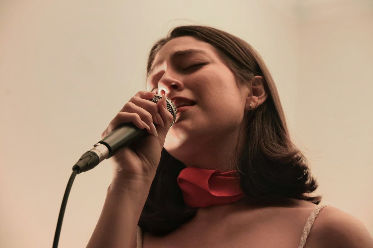 Singer performing into a microphone