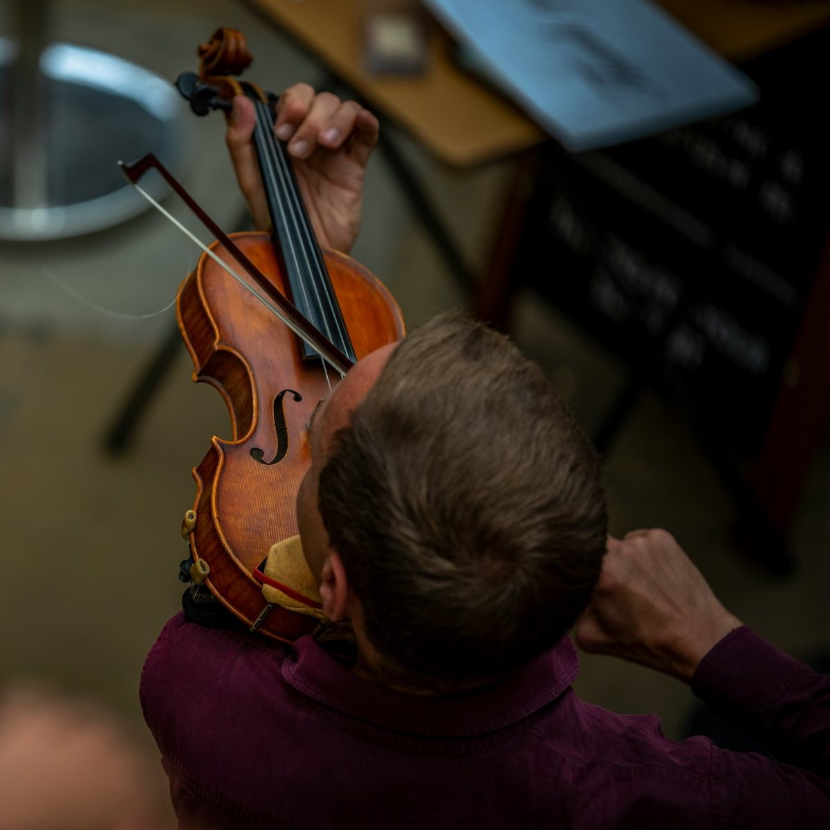 Violinist playing, seen from above